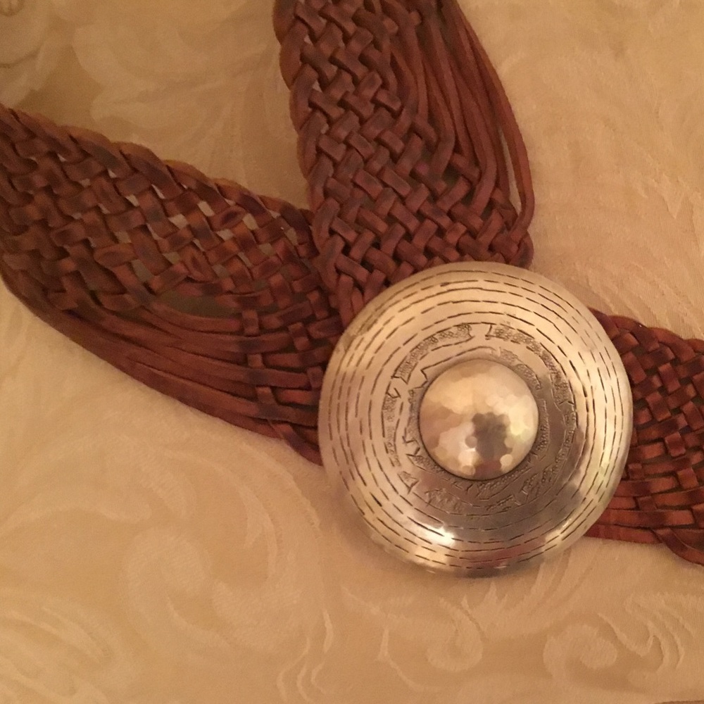 Leather belt with silver buckle.